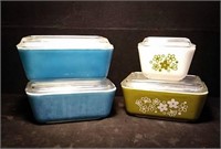 Four Pyrex refrigerator dishes, two are in the