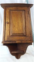 Beautiful stained corner cabinet.