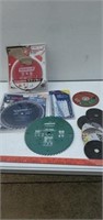 A variety of saw blades and grinding wheels.