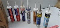Different kinds of caulk, at least 18 tubes.