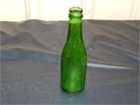 Antique 7-UP bottle embossed shoulder, nothing els