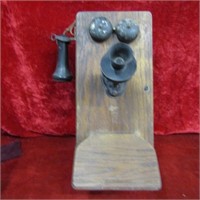 Antique oak wall mount telephone.