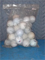 Three dozen used golf balls