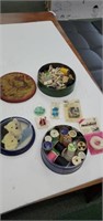 2 metal tins and assorted sewing accessories