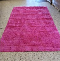 Pink Shag area rug.  111 by 72 inches.