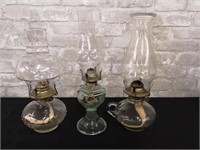 Vintage oil lamps with chimneys.