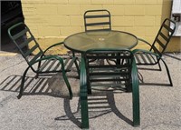 Patio table and chairs in green.