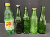 Lot of Early Green Soda Bottles
