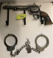REVOLVER LOOK COAT RACK AND HAND CUFFS
