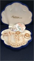 Cultured pearls and a mother of Pearl piece