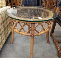 Glass topped round wicker table