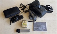 2 35mm camera and a PocketDV 3100 with tripod