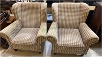 2 matching lounge chairs with a gray and white