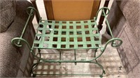 Green metal bench or side table with a woven
