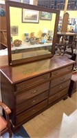 8 drawer dresser with a mirror in the back -