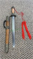 23 inch Chinese dagger with a wood and brass