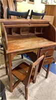 Small child size roll top desk with a small