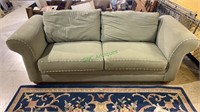 Light sage-green full-size sofa with four back