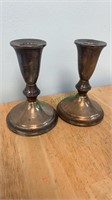 Pair of sterling silver candlesticks with cement