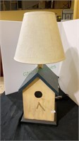 20 inch table lamp in the form of a birdhouse.