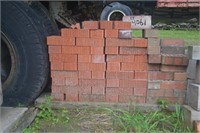 Pallet of red bricks