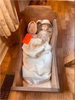 Antique doll and cradle