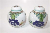 Pair of porcelain hand painted Famille Rose jars