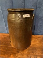 8 gallon brown crock with a crack