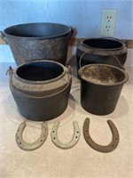 Four cast-iron pots and three horse shoes