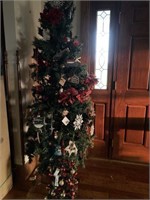 Artificial Christmas tree with ornaments and