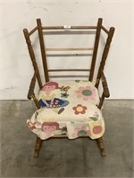 Child’s rocking chair with cushion