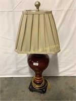 Red table lamp with shade