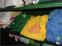 Shelf w/ new clothing, child's hooded towels -