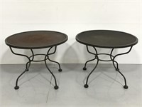 Pair of matching round metal patio side tables