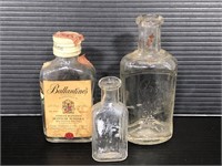 Three small glass bottles