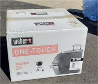 New in box Webber 1 touch charcoal grill.