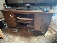 TV stand including DVD Player.