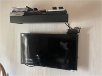 Samsung TV mounted on wall + DVD player