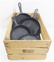 Grouping of Cast Iron Skillets in Wood Crate