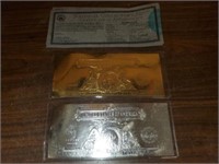 set of gold and silver leaf $2 dollar bills