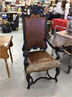 Large wooden chair with tooled leather seats