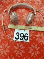 2 pairs of Bluetooth headphones, one earbuds