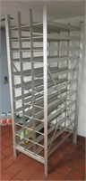 Metal food can holder. Measures 83" h x 27" w x