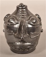 Seagreaves Manganese Glazed Grotesque Face Jug.