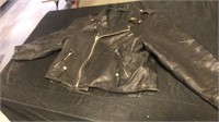 Black leather jacket. Size unknown
