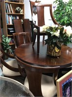 Dining table with six chairs and two leaves