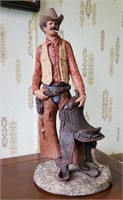 Cowboy sculpture. 15 in tall