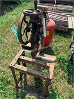 Antique drill press and grinding wheel on stand