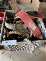Crate of Climbing Belts and Rope