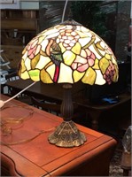 Stained glass lamp with birds on shade